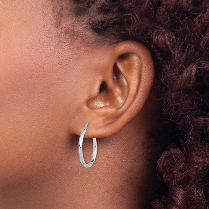 25 mm twisted hoop earrings shown on ear