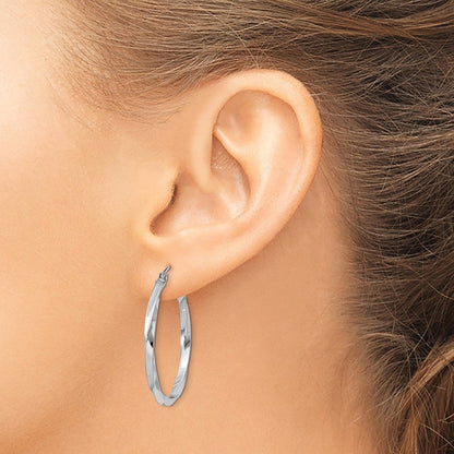 30 mm twisted hoop earrings shown on ear