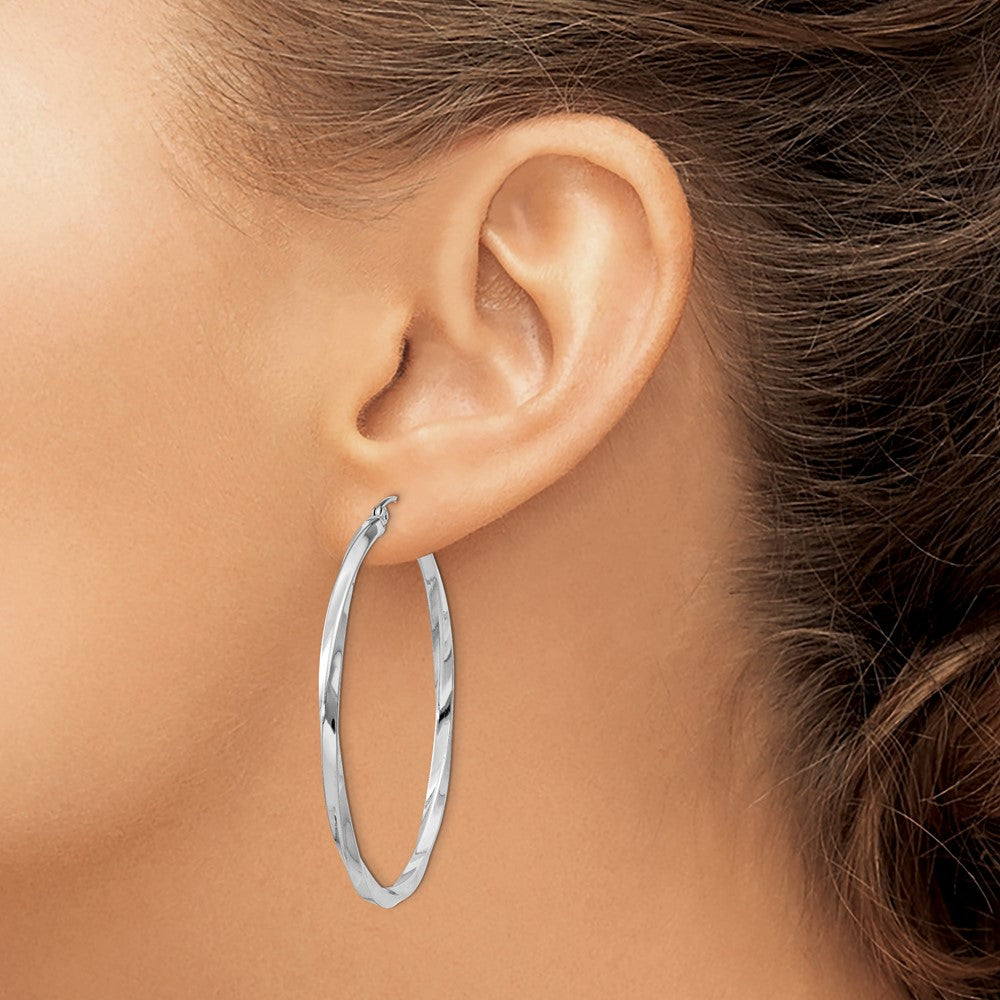 45 mm twisted hoop earrings shown on ear