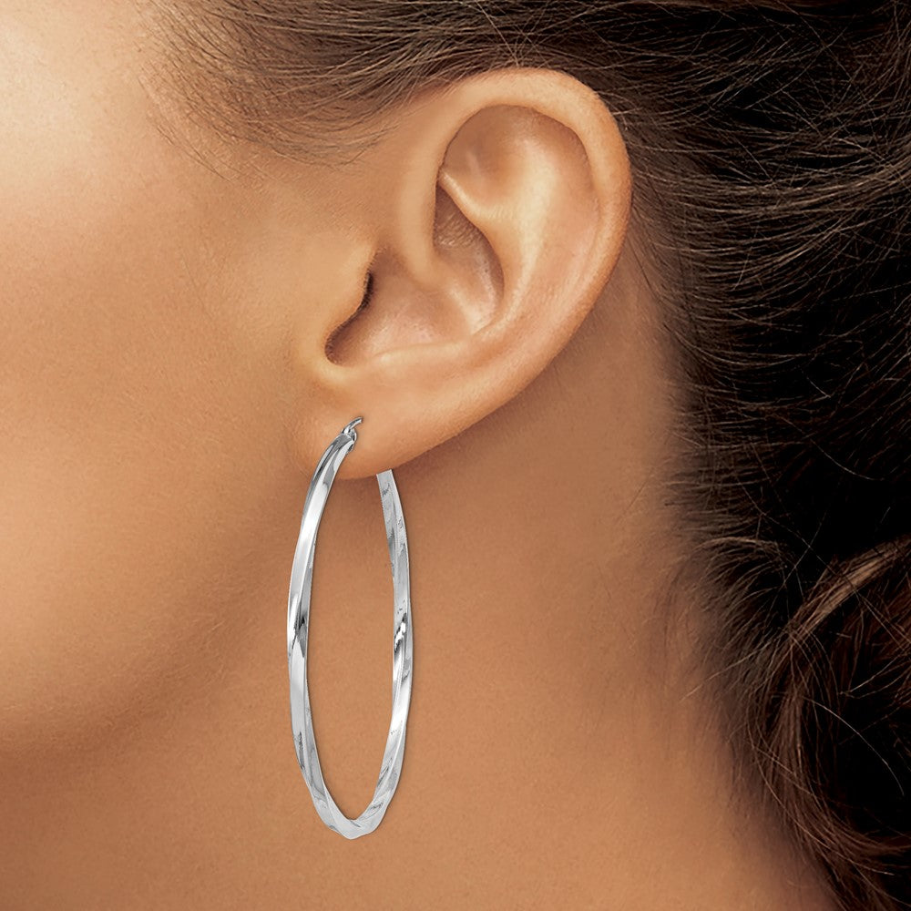 50 mm twisted hoop earrings shown on ear